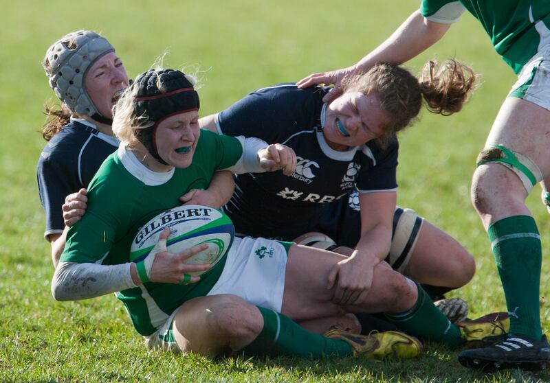 Scotland Women's Susie Brown (left) & Rosalind Murphy (right) tackle Ireland Woman's Joy Neville (centre) during the Womens RBS 6 Nations match at Lasswade, Edinburgh.