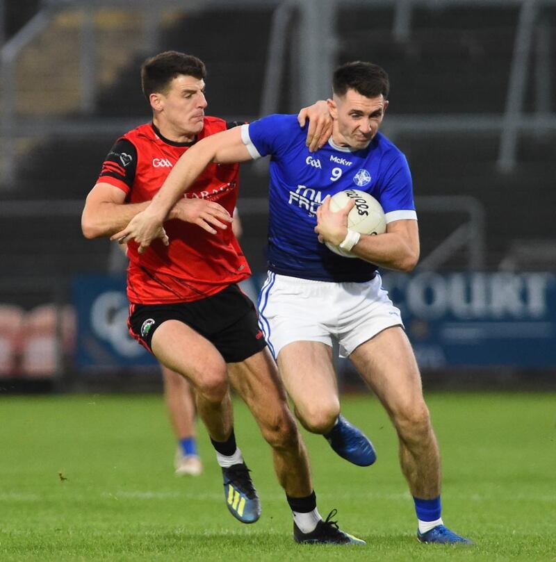 Niall Grimley of Madden tries to dispossess his county team-mate Shane McPartlan