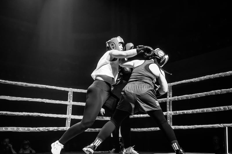 Diona Doherty lands a punch on Brónagh Diamond at the charity boxing even