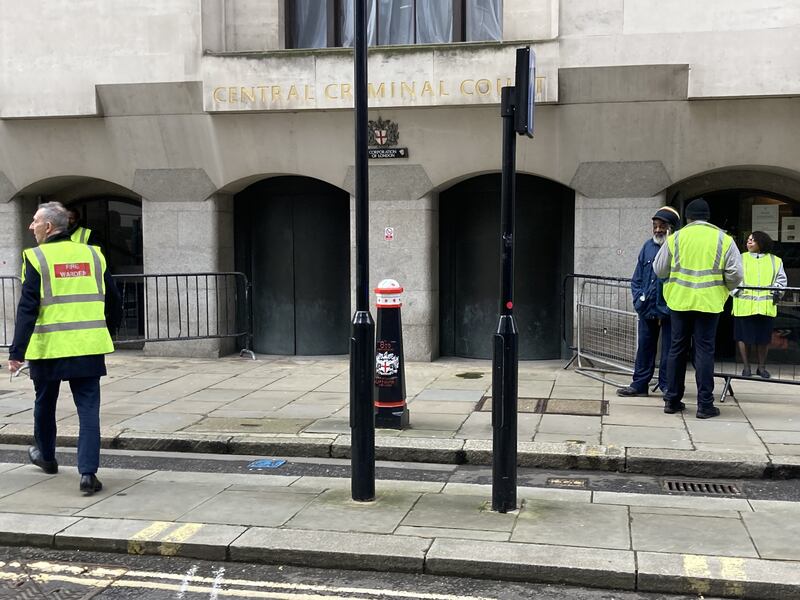 Staff members outside the Old Bailey after the fire alert