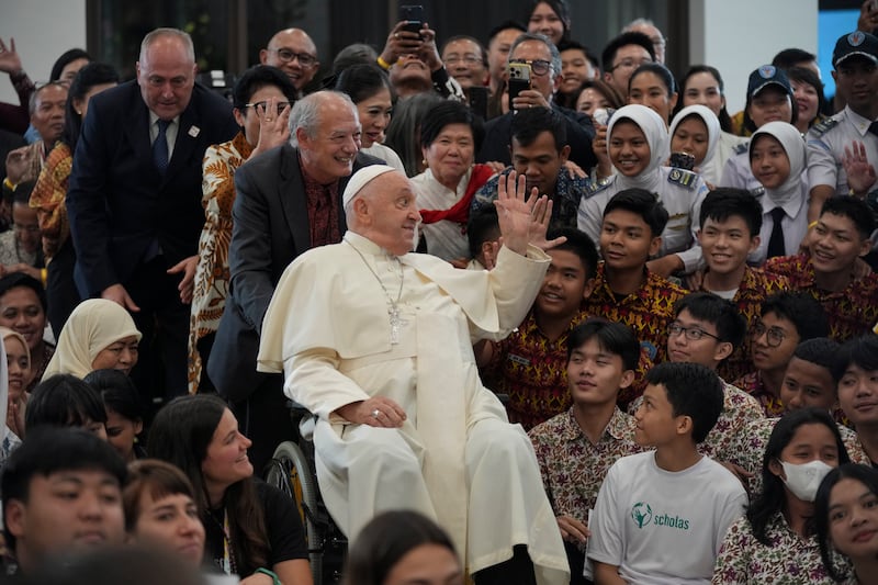 Pope Francis interacts with the young people of Scholas Occurrentes at Grha Pemuda Youth Centre (Tatan Syuflana/AP)