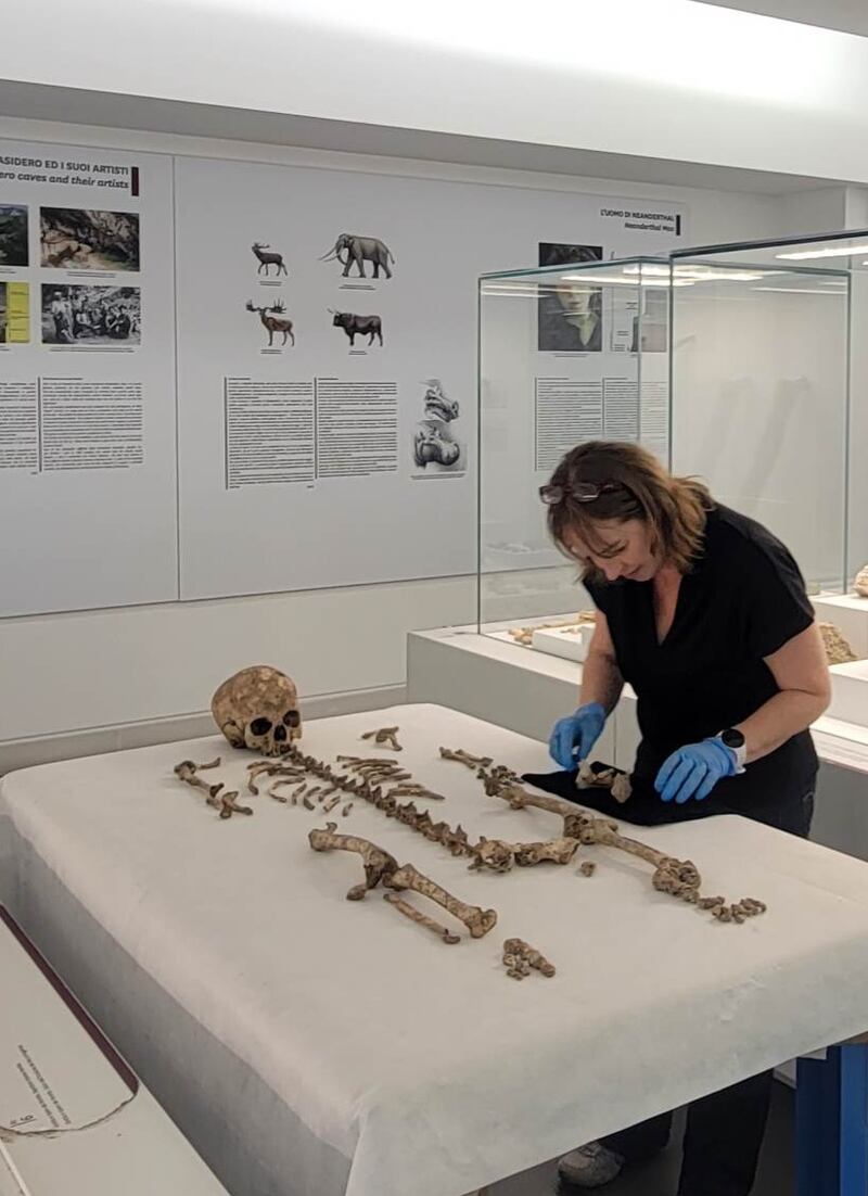 Dr Mary Lewis from the University of Reading inspecting the skeletal remains of Romito 2found in southern Italy (University of Reading)