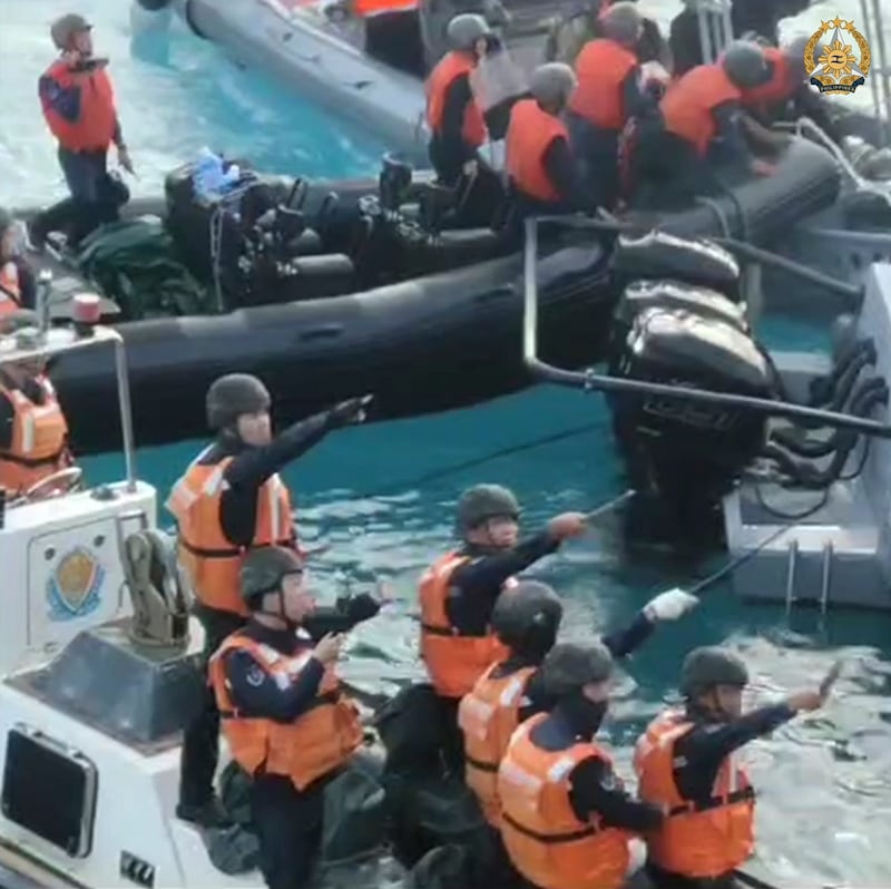 Chinese Coast Guard hold knives and machetes as they approach Philippine troops on a resupply mission in the Second Thomas Shoal at the disputed South China Sea in June 17, 2024 (Armed Forces of the Philippines/AP)