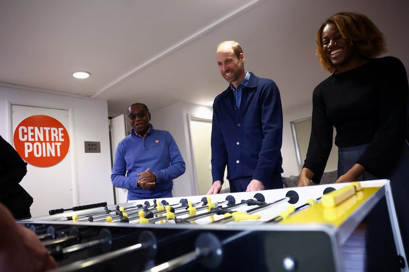 William joins in a game of table football at Centrepoint in Ealing, west London