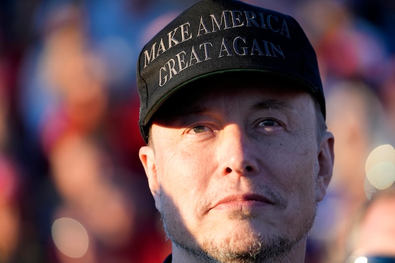 Mr Musk listens as Mr Trump speaks (Alex Brandon/AP)