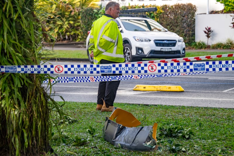 Debris from a helicopter lies on the ground after it crashed into the roof of the Double Tree by Hilton Hotel, in Cairns (Brian Cassey/AAP/AP)