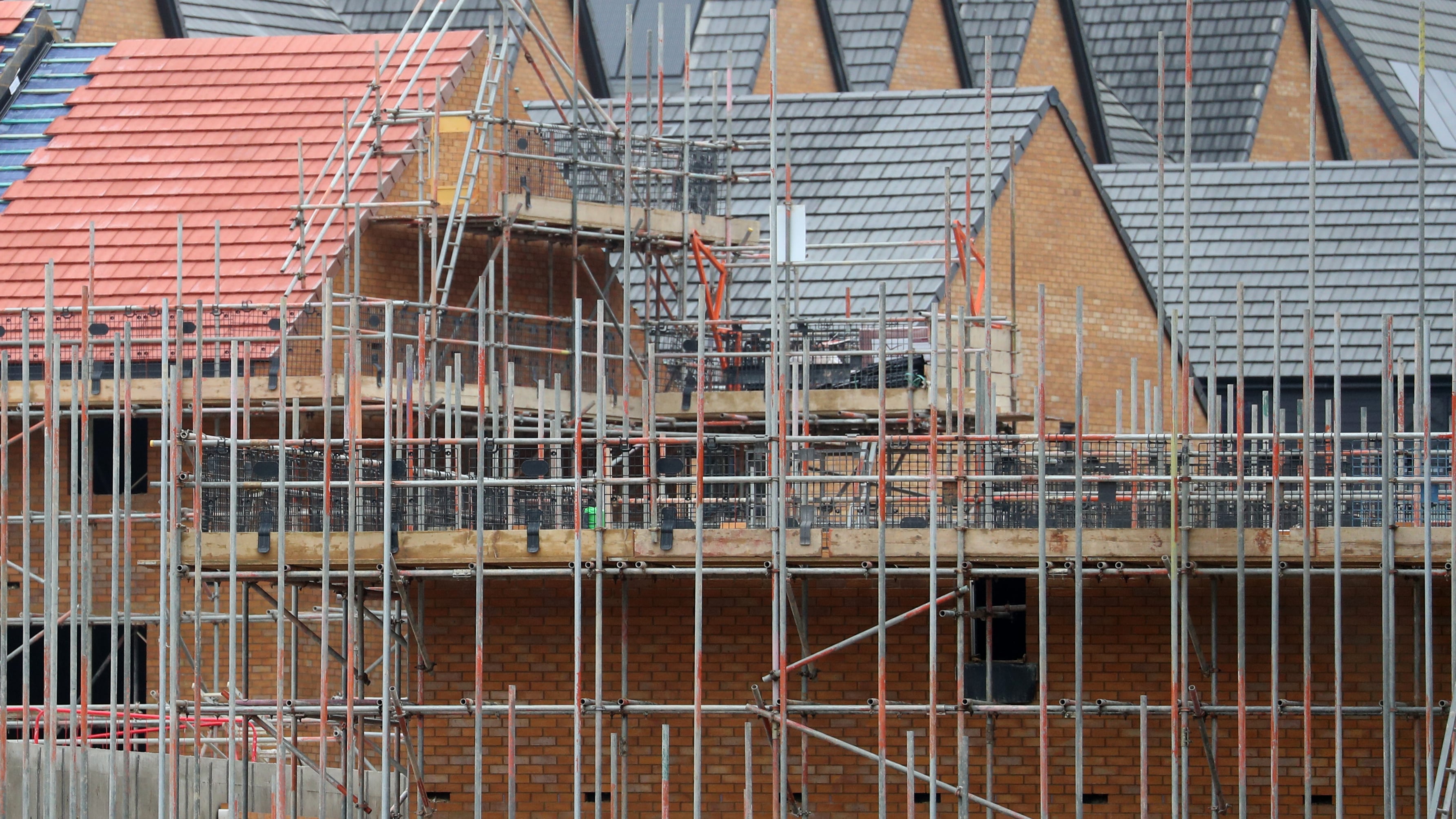 Building firms said momentum improved on the back of rising workloads