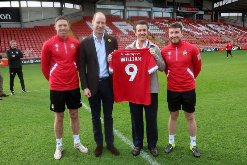 William with his personalised Wrexham AFC shirt, meeting club chairman Ben Tozer, Rob McElhenney and captain Luke Young