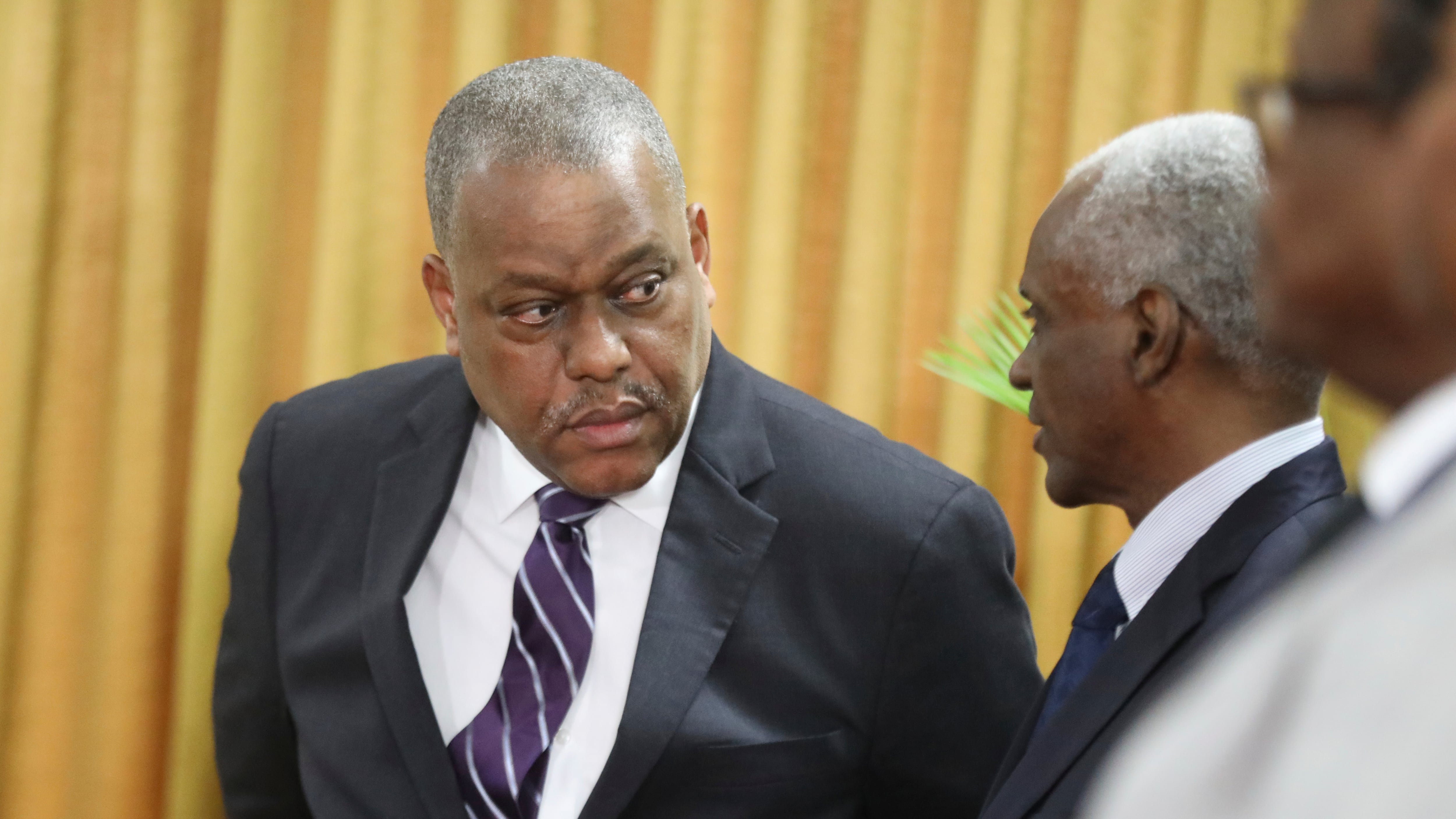 New Haitian Prime Minister Garry Conille, left, speaks to the president of the council Edgard Leblanc Fils during his swearing-in ceremony in Port-au-Prince, Haiti (Odelyn Joseph/AP)