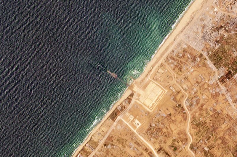 A satellite image showing the pier (Planet Labs PBC via AP)