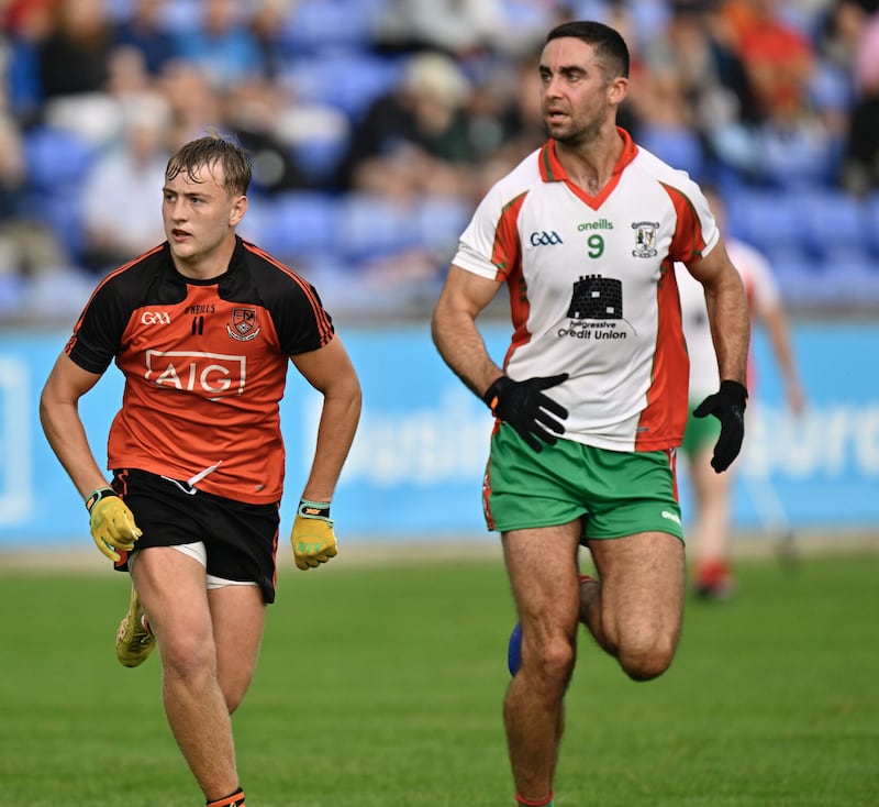 Dublin captain James McCarthy (right) in action for Ballymun against Ballinteer/St Johns's in the Dublin SFC.