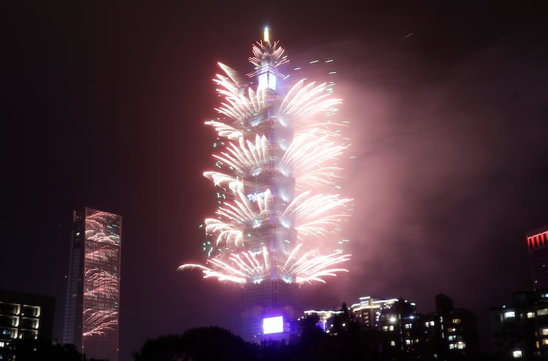 Fireworks at the Taipei 101 building during the New Year celebrations in Taipei, Taiwan (Chiang Ying-ying/AP)