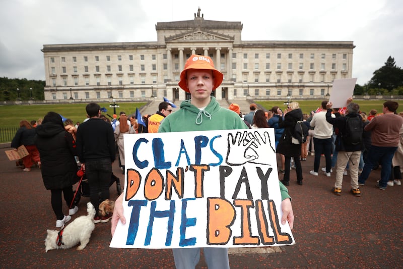 Junior doctor Ross Brown protesting outside Stormont, as they take part in a 48-hour strike over pay and staff retention