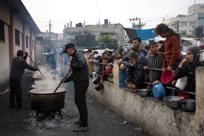 Palestinians queue up for food in Rafah (Fatima Shbair/AP)