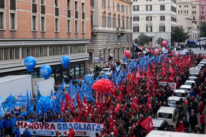 Demonstrators marched along streets in Rome (Gregorio Borgia/AP)