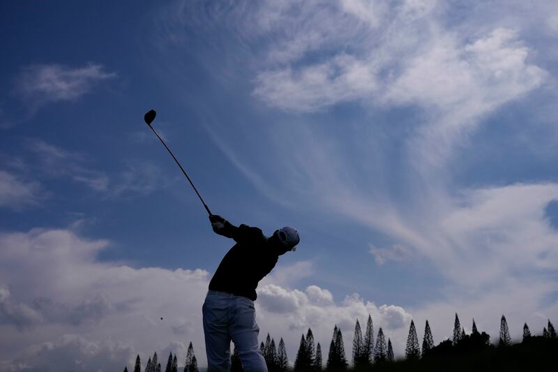 Hideki Matsuyama, of Japan, hits from the 14th tee (Matt York/AP)