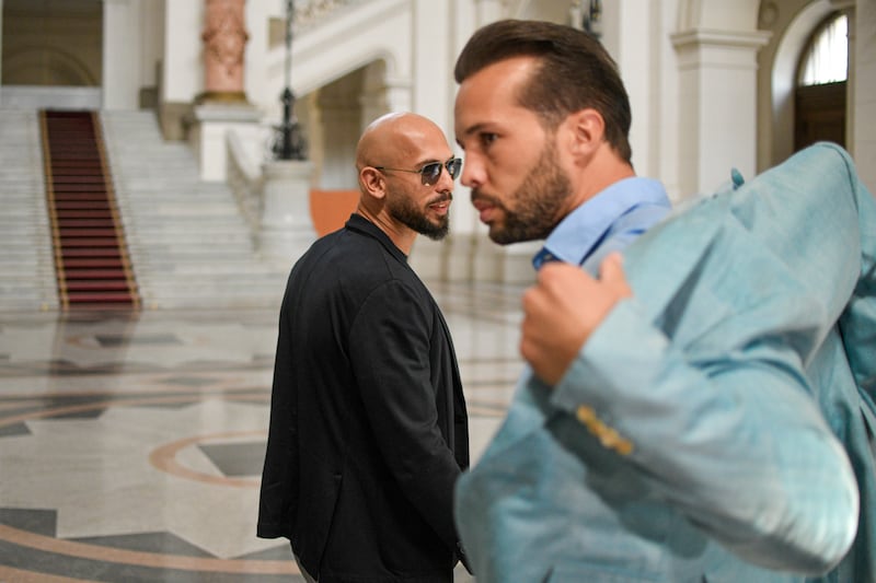 Andrew Tate, left, and his brother Tristan at a court in Bucharest (Alexandru Dobre/AP)