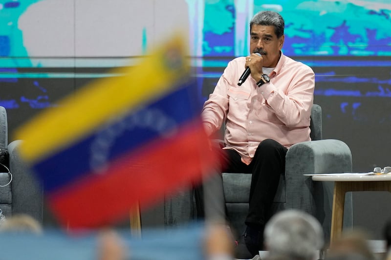 Venezuelan President Nicolas Maduro speaks during a meeting with international observers in Caracas (Matias Delacroix/AP)