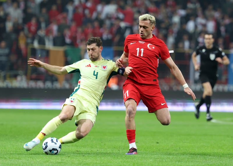 Wales captain Ben Davies challenges Turkey forward Baris Alper Yilmaz in Kayseri (Huseyin Yavuz/Dia Photo via AP)