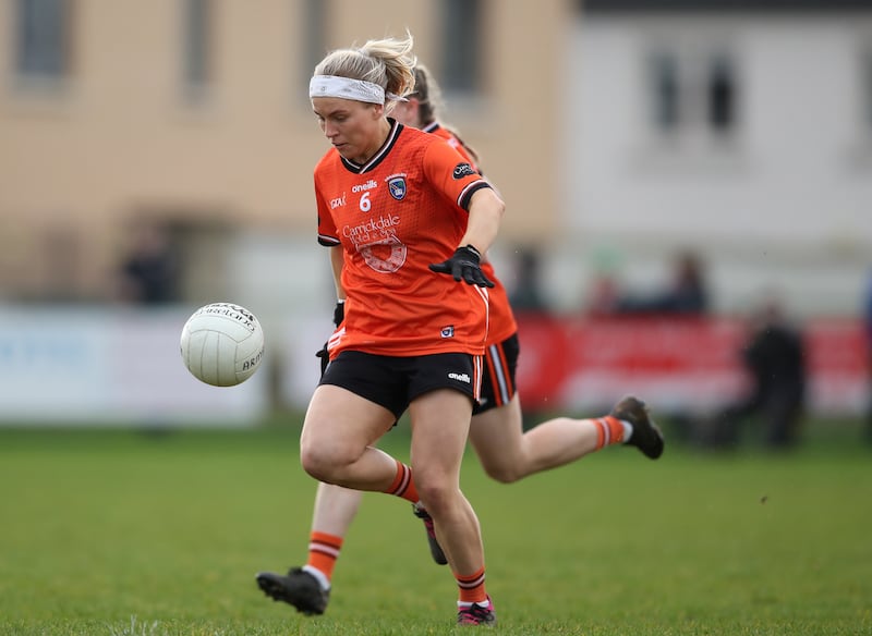 Lauren McConville performing a kick-pass against Meath