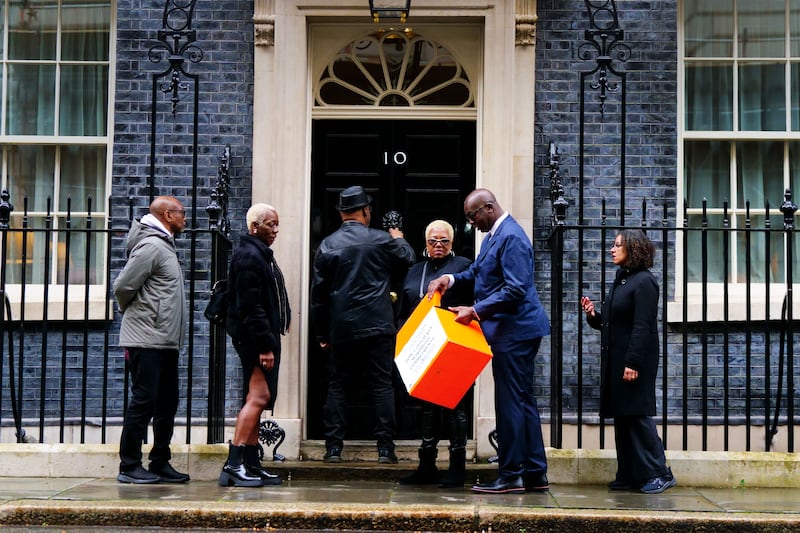 Windrush campaigners hand in a petition to 10 Downing Street