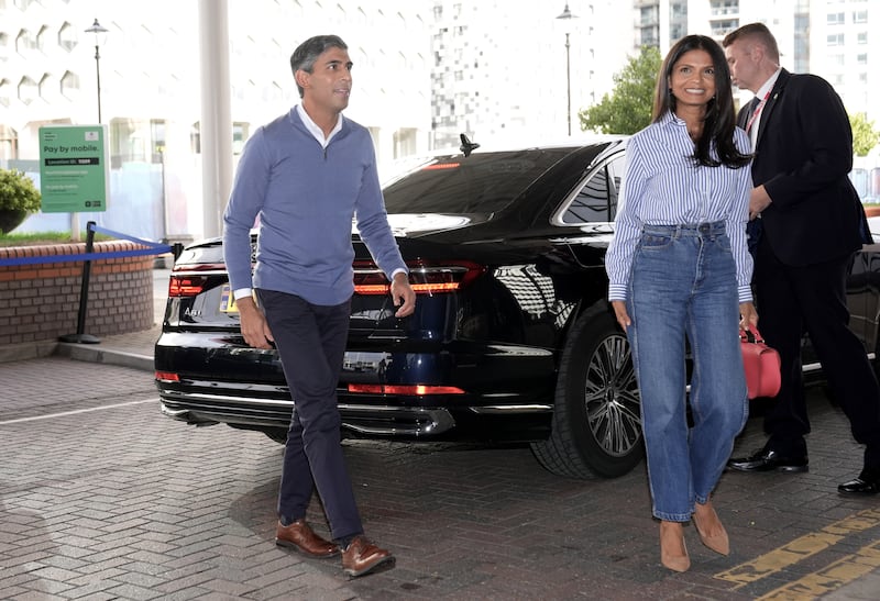 Conservative party leader Rishi Sunak with his wife Akshata Murty arriving in Birmingham on the eve of conference