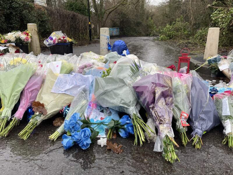 Flowers laid at the entrance to the country park where Leo was stabbed