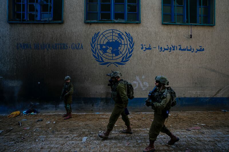 Israeli soldiers take position as they enter a UNRWA centre in Gaza (AP Photo/Ariel Schalit, File)