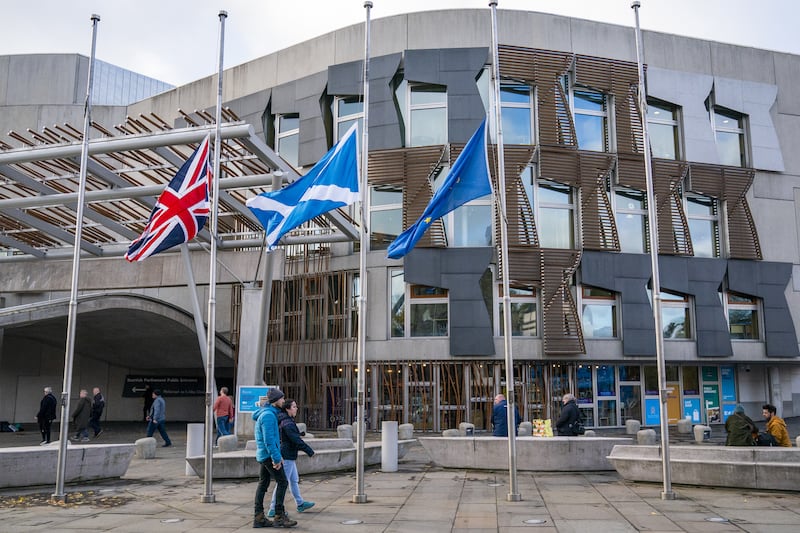 Flags were lowered to half-mast outside the Scottish Parliament while Holyrood paid tribute to Alex Salmond