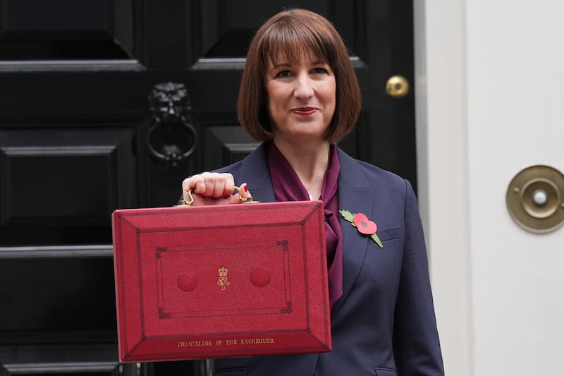 Chancellor Rachel Reeves poses with her ministerial red box, before delivering her Budget