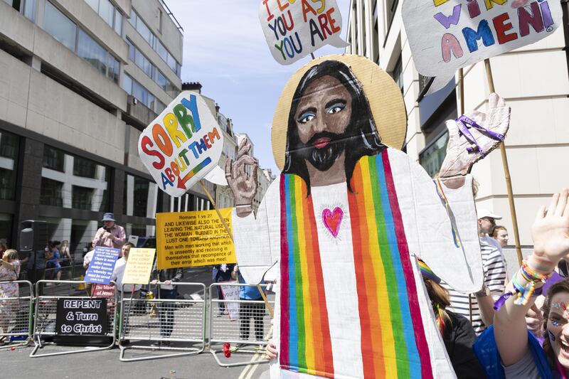 Beside a Christian counter-protest was a cardboard cut-out of Jesus Christ holding a sign saying ‘I’m sorry about them’