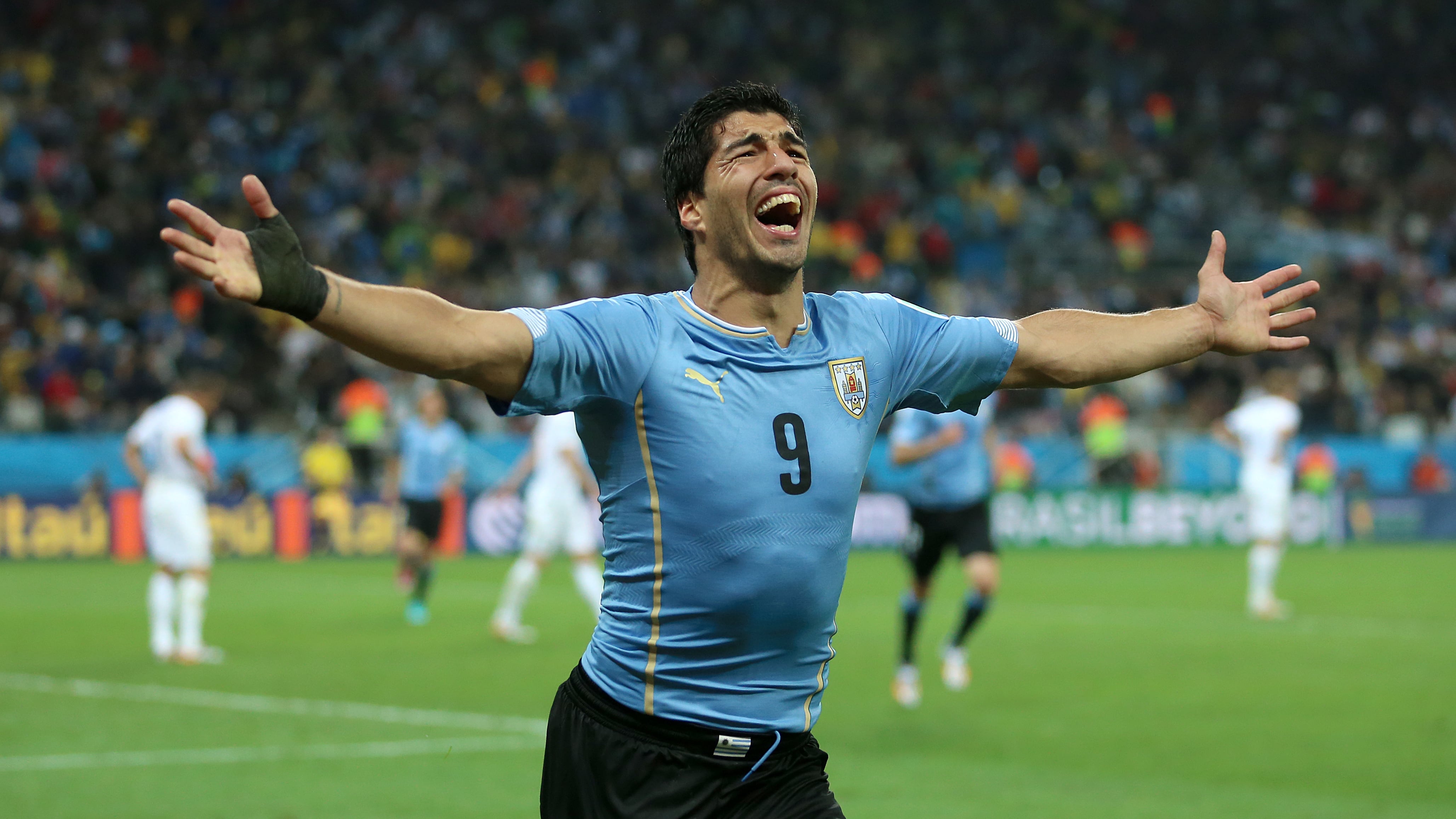 Luis Suarez scored twice as Uruguay left England on the brink of elimination from the 2014 World Cup