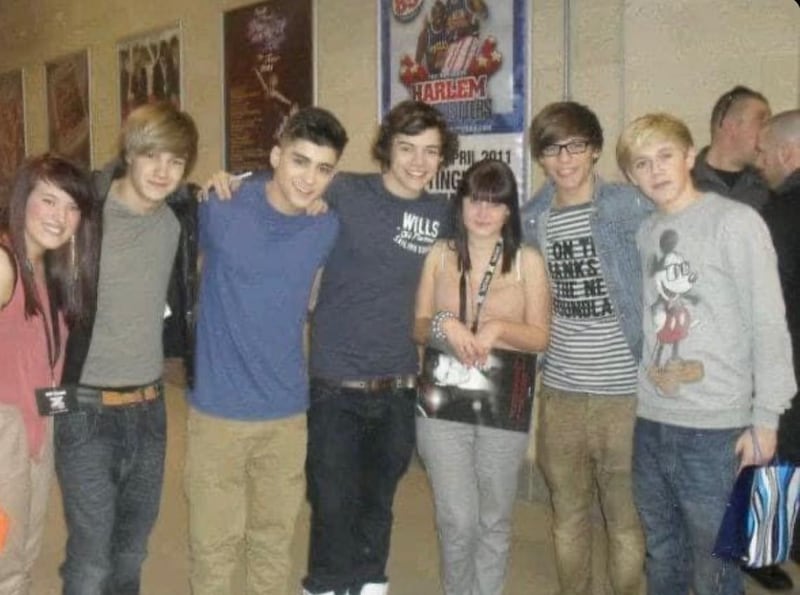 Molly Moore (centre) and her friend (left) meeting One Direction backstage at the X Factor in 2011