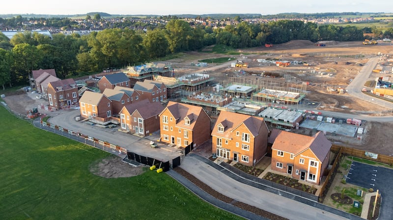 Aerial view looking down on new build housing construction site in England, UK