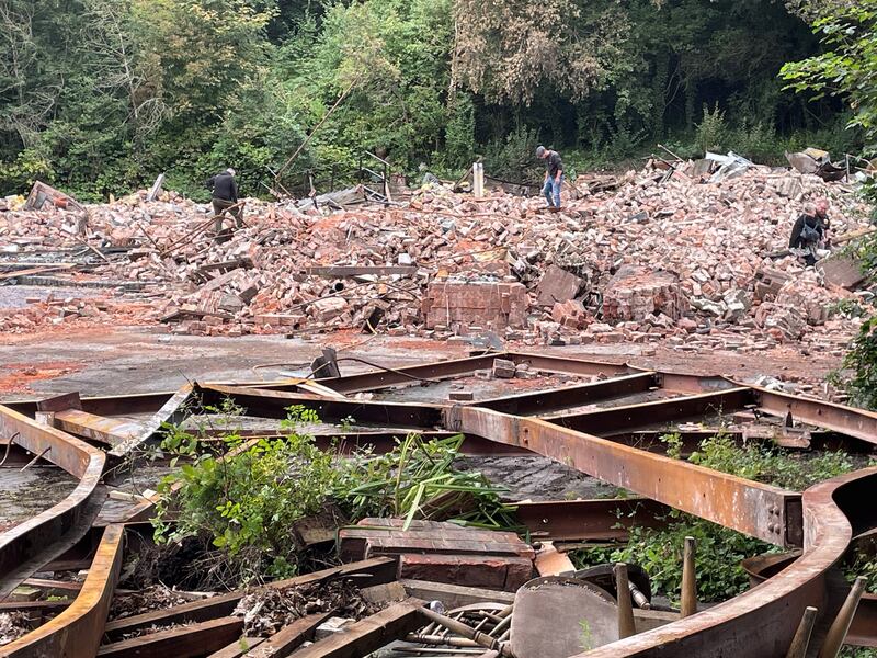 People inspect the remains of The Crooked House pub in Himley, near Dudley in the West Midlands, which was demolished two days after it was gutted by fire