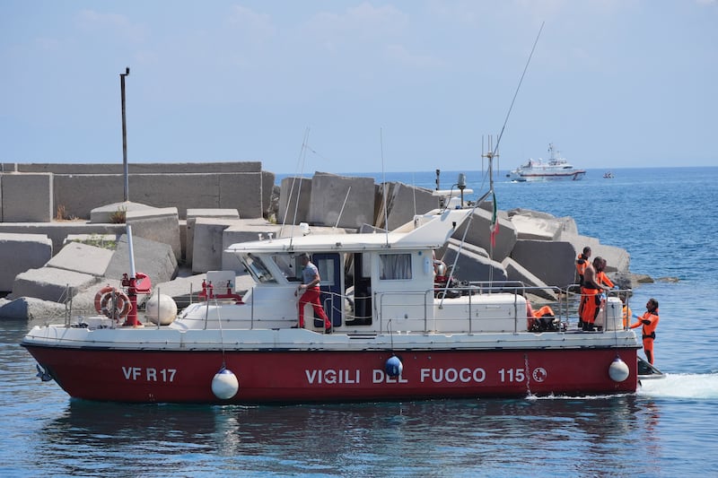 A fire service dive boat with the body of Hannah Lynch returns to Porticello harbour