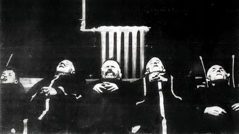 The bodies of Owen McMahon (middle), his sons, and employee Edward McKinney (far right) at the Mater Hospital morgue