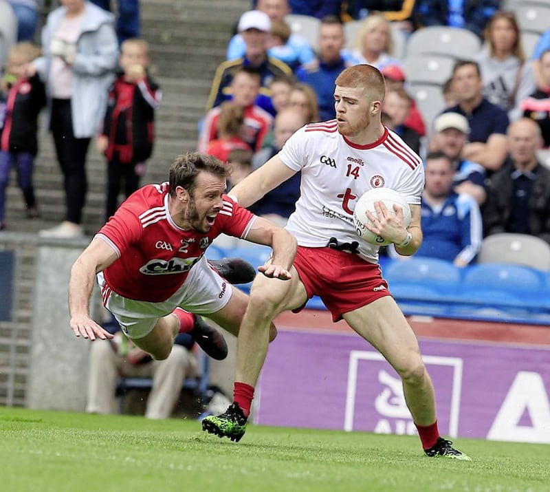 Tyrone&#39;s Cathal McShane and Cork&#39;s James Loughrey battle it out on Saturday. Picture by Philip Walsh. 