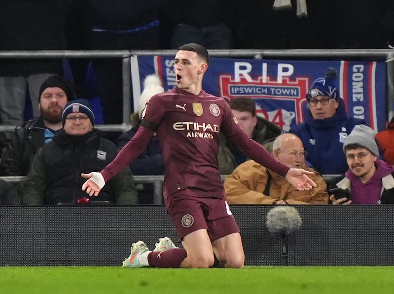 Manchester City’s Phil Foden celebrates his opening goal against Ipswich .