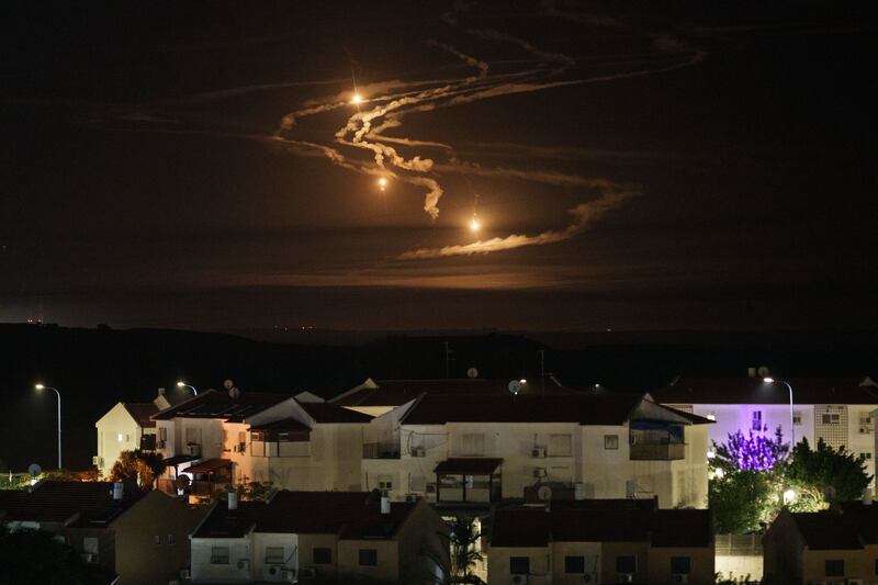 Flares rise over the Gaza Strip as seen from southern Israel (Leo Correa/AP)