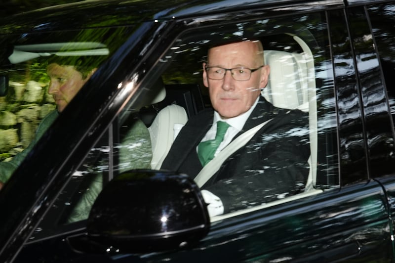 First Minister of Scotland John Swinney in the front seat of a car leaving Crathie Kirk on Sunday