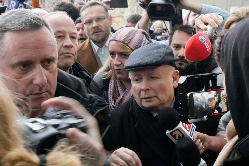 Jaroslaw Kaczynski, right, arrived at the headquarters of Poland’s state-owned TVP broadcaster to protest against the move (Czarek Sokolowski/AP)