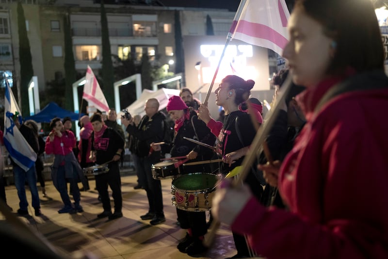 Activists protest in Tel Aviv, Israel, against Prime Minister Benjamin Netanyahu, calling for new elections (Maya Alleruzzo/AP)