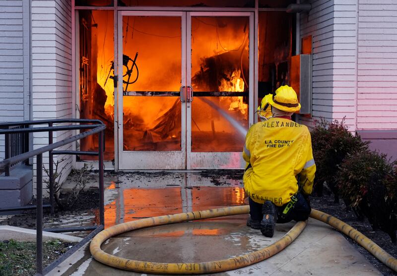 Firefighters worked to contain a fire at a Bank of America branch in Pasadena (Chris Pizzello/AP)