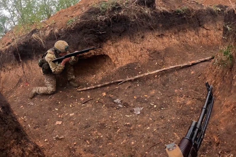 Russian servicemen take part in a combat training for assault units at an undisclosed location in Ukraine (Russian Defense Ministry Press Service/AP)