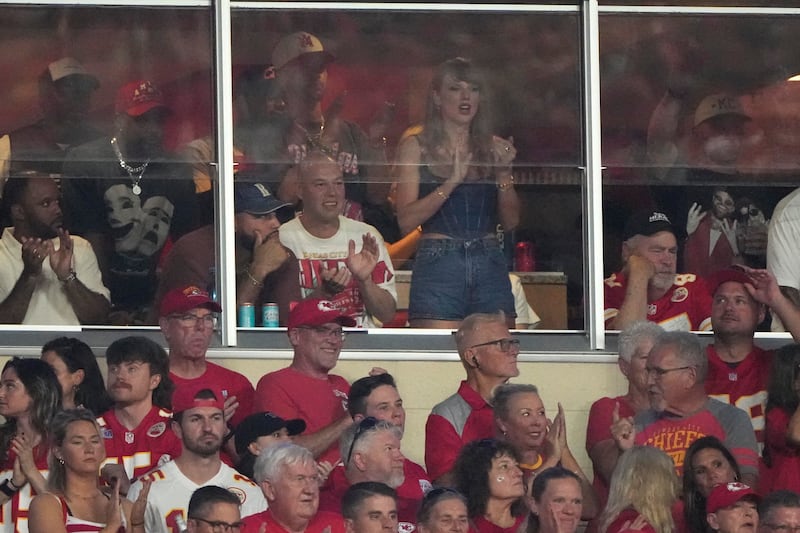 Taylor Swift is seen in a suite during the first half of an NFL football game between the Kansas City Chiefs and the Baltimore Ravens (AP Photo/Charlie Riedel)