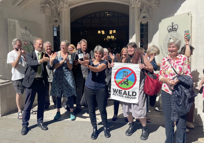 Environmental campaigner Sarah Finch (centre) with supporters outside the Supreme Court in London