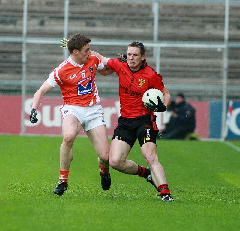 Peter Fitzpatrick tangles with Armagh's Charlie Vernon at the Athletic Grounds. Pic Seamus Loughran