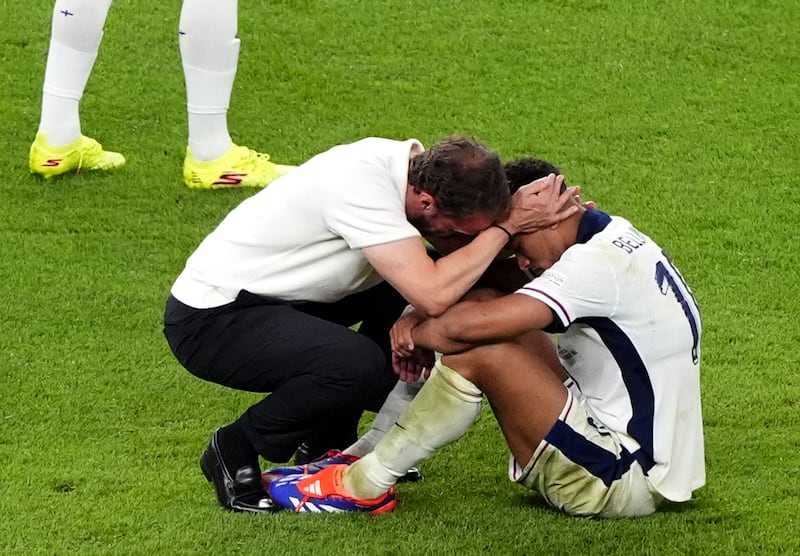 England manager Gareth Southgate commiserates with Jude Bellingham