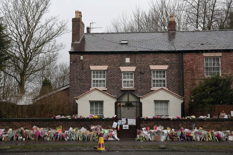 Floral tributes outside the comedian's home (Aaron Chown/PA)